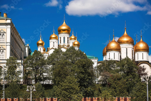 Moscow on a sunny day. The Grand Kremlin Palace, the Annunciation Cathedral, the Archangel Cathedral and the bell tower of Ivan the Great on the Kremlin embankment. The business card of Moscow.