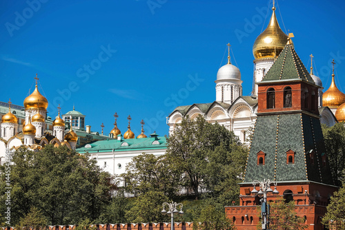 Moscow on a sunny day. The Grand Kremlin Palace, the Annunciation Cathedral, the Archangel Cathedral and the Kremlin towers on the embankment. The business card of Moscow.