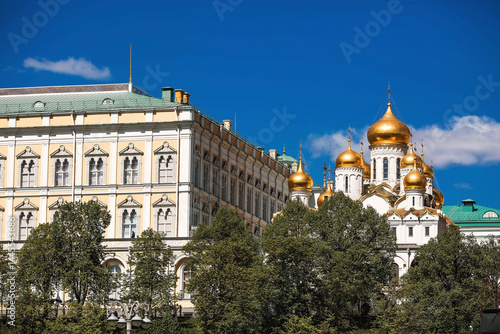 Moscow on a sunny day. The Grand Kremlin Palace, the Annunciation Cathedral, the Archangel Cathedral and the bell tower of Ivan the Great on the Kremlin embankment. The business card of Moscow.