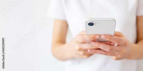 Girl Holding Phone in Hands and Typing