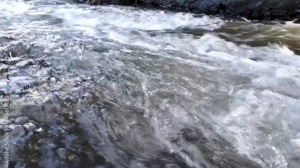 water flowing over rocks, strong water currents water flowing over rocks, strong water currents