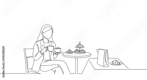 Woman enjoying tea with pastries in a minimalist cafe  