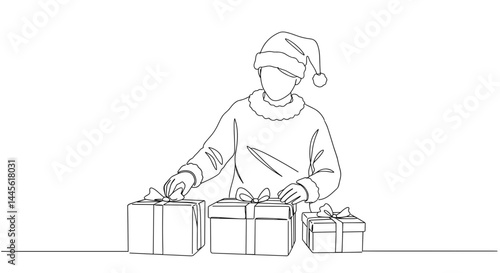 Person arranging Christmas gifts in a minimalistic style  