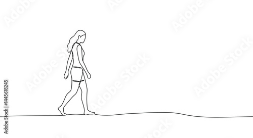 Woman walking calmly on a sandy shore  