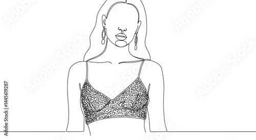 Female model posing in stylish clothing against a simple background  