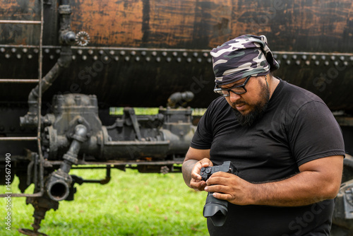 Tableau sur toile Costa Rican man checking camera settings while working on a production