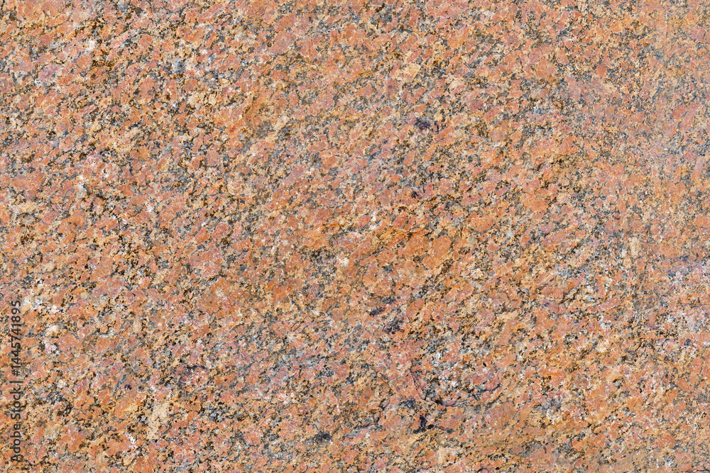 Polished granite texture, showcasing its beautiful texture and natural patterns. Stone features a blend of warm orange, brown, and black colors Polished granite texture, showcasing its beautiful texture and natural patterns. Stone features a blend of warm orange, brown, and black colors