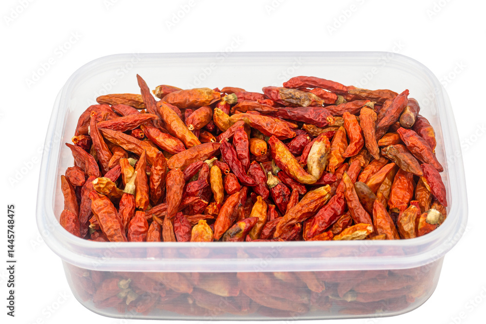 A white bowl holds a pile of delicious red hot chili peppers, a key ingredient in many spicy food cuisines A white bowl holds a pile of delicious red hot chili peppers, a key ingredient in many spicy food cuisines