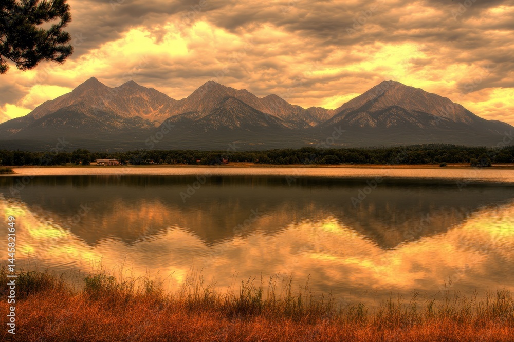 Fototapeta premium Serene mountain lake reflection at golden hour