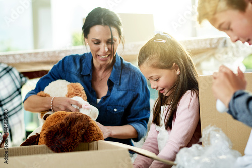 Canvastavla Moving, boxes and mother with children for packing in new home with sorting toys for donation or charity