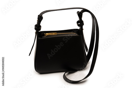 Black small leather cross body bag isolated on a white background.