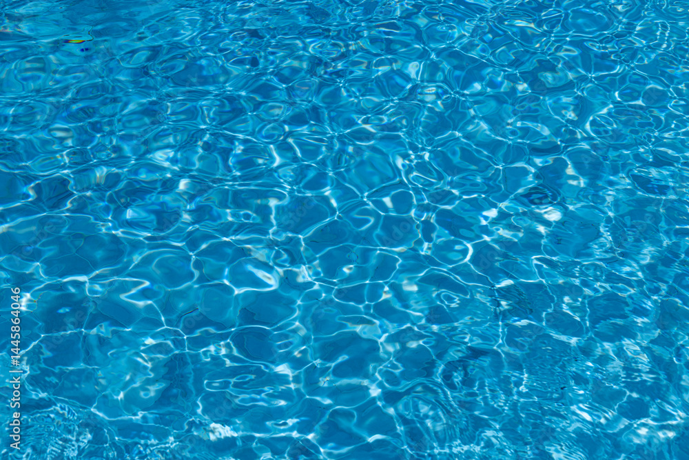 Obraz premium Blue Water Pool Surface with Sunlight Reflections