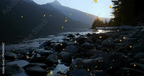 Rocky lakeshore being animated at dusk in flat design, showing driftwood logs and golden sparkles