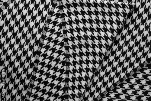 Obraz na płótnie Close-up of black and white houndstooth scarf with visible folds and texture. w salonie