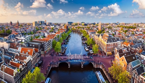 amsterdam city center aerial view skyscape from above historic buildings dutch architecture and canal with boats and bridge amsterdam drone cityscape the netherlands