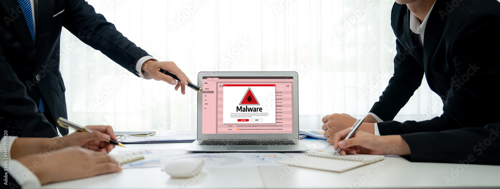 Cyber attacking concept. Malware alert showing on computer screen display scam and threat detection on computer system or online server to be removed brisk.