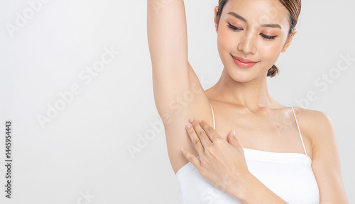Armpit epilation, lacer hair removal. Young asian woman holding her arms up and showing clean underarms, depilation smooth clear skin .Beauty cosmetology portrait. Generated Image