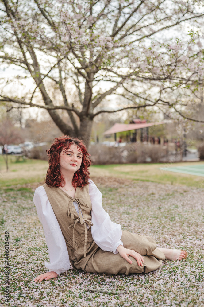 Teen girl sitting in a field Teen girl sitting in a field