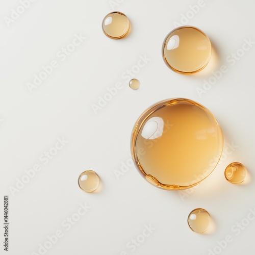 An abstract composition of clear, golden-hued liquid droplets, creating a captivating visual with their transparency and gentle glow