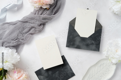 Elegant Wedding Stationery with Envelopes and Flowers