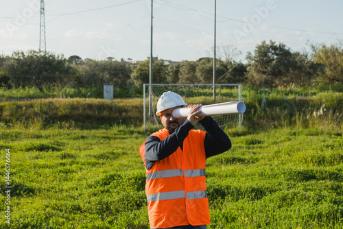 Engineer Using Document As Binoculars 