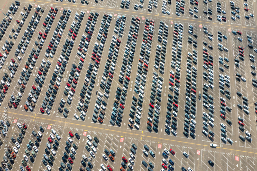 Obraz premium New cars parked for sale on automotive factory parking lot. Dealer vehicle inventory for import and export business commercial worldwide