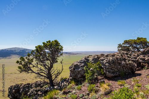 Serene landscape of the volcanic field seen from Crater Rim Trail at Capulin Volcano National Monument. 