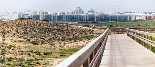 Large apartment complex near sand dunes