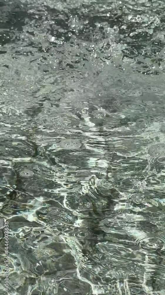 Flowing and bubbling fountain water waves Flowing and bubbling fountain water waves
