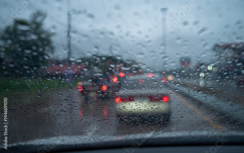 Obraz na płótnie Rain drop on the car glass window while driving on the road. w salonie