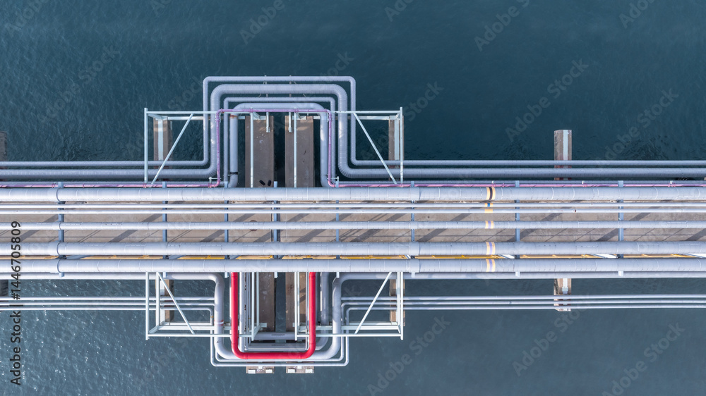 Aerial view industrial oil and gas pipeline system, Energy industry pipeline structure oil and gas refinery, Industrial pipeline system petrochemical plant refinery, Petrochemical pipeline network.