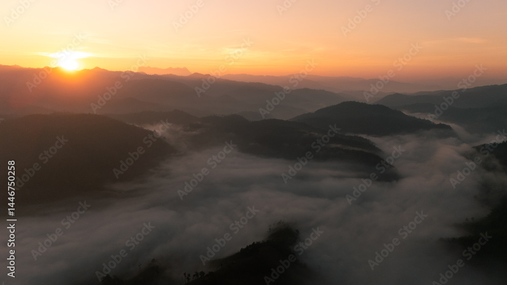 Clouds on high mountain peaks in the rainy season in the Asian rainforest. Clouds on high mountain peaks in the rainy season in the Asian rainforest.