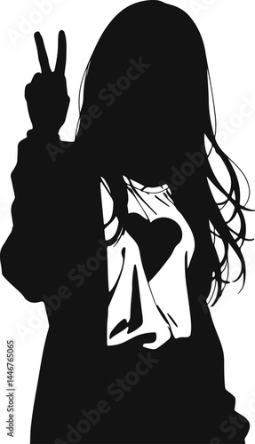 Silhouette of a woman wearing a shirt with a heart design, holding up a peace sign gesture