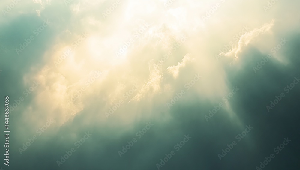 Fototapeta premium Sunbeams pierce through dramatic, dark clouds