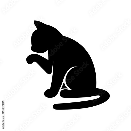 the cat licks its paw Silhouette