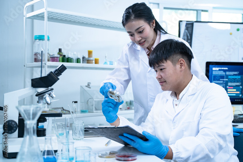 Multidisciplinary science students work in a modern lab analyzing microbial samples to support research in biology chemistry health and other scientific fields