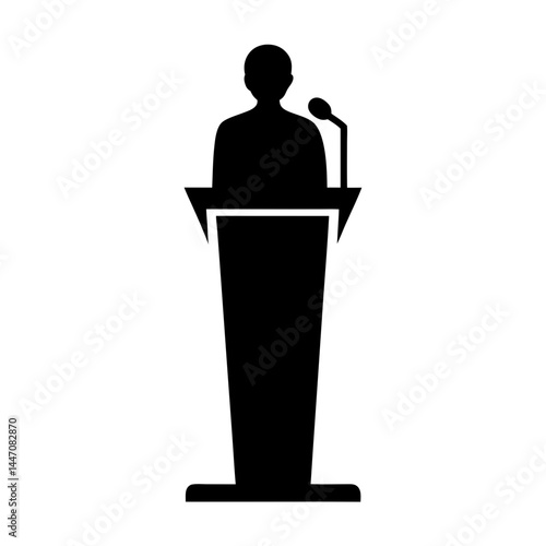 Silhouette of a speaker giving a speech at a podium with microphone