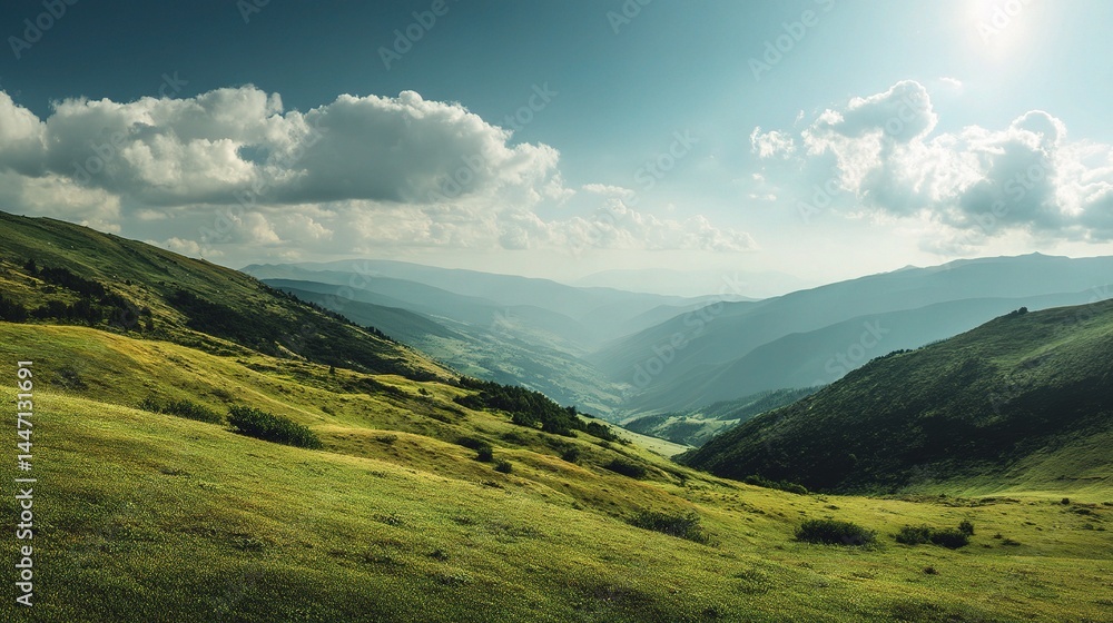 Fototapeta premium Serene Green Hillside Under a Wide Open Sky in Sunlit Valley