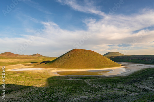 Meke Lake volcanic crater reflecting clouds in Turkey during sun
