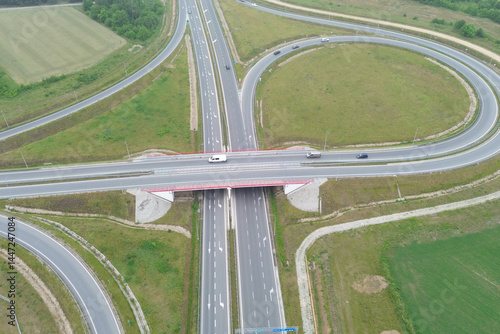 Cars and trucks driving on elevated freeway bridge