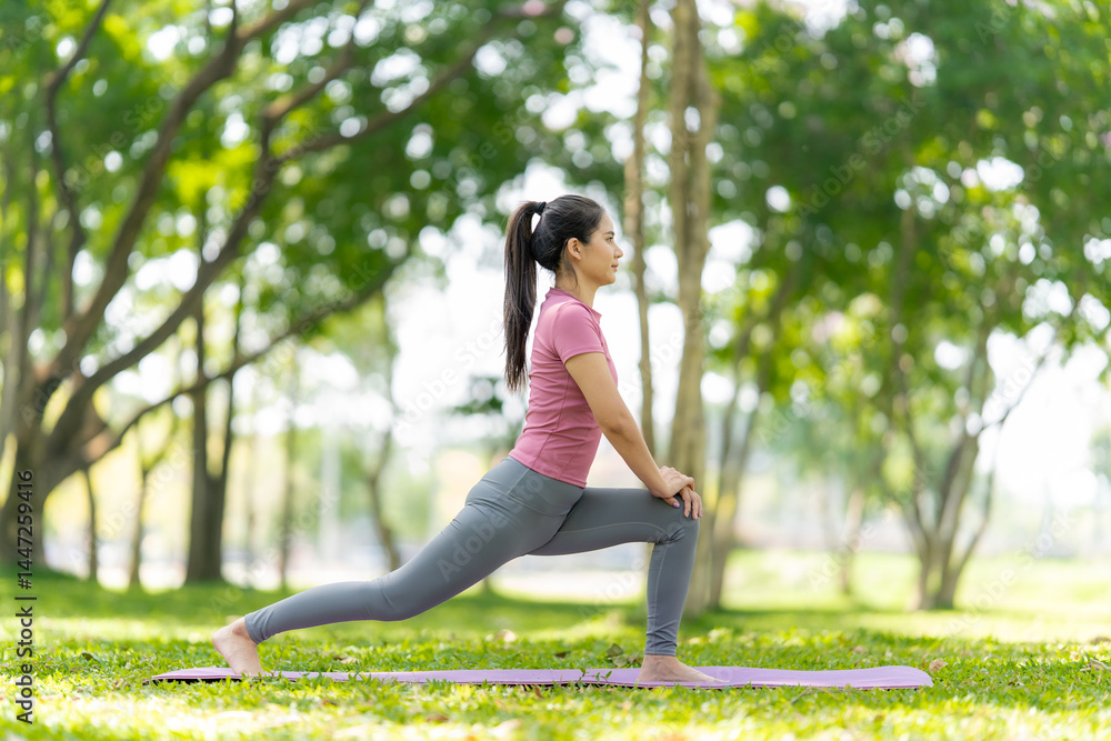 Fototapeta premium Woman Stretching Outdoors in Park