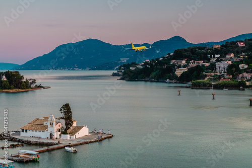Obraz na płótnie Typical view of Vlacherna Monastery and Mouse island with airplane landing, Corfu, Greece w salonie