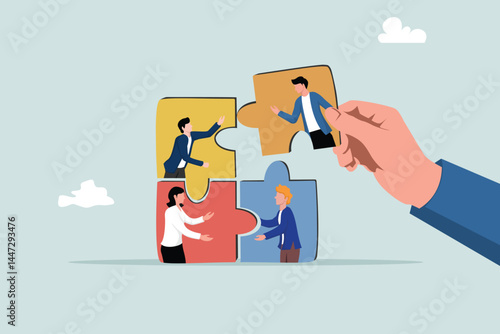 New joiner to fill in team and solve problem, teamwork to get solution, put right man in the right job to fit job description concept, businessman hand HR put new joiner to connect jigsaw puzzle.