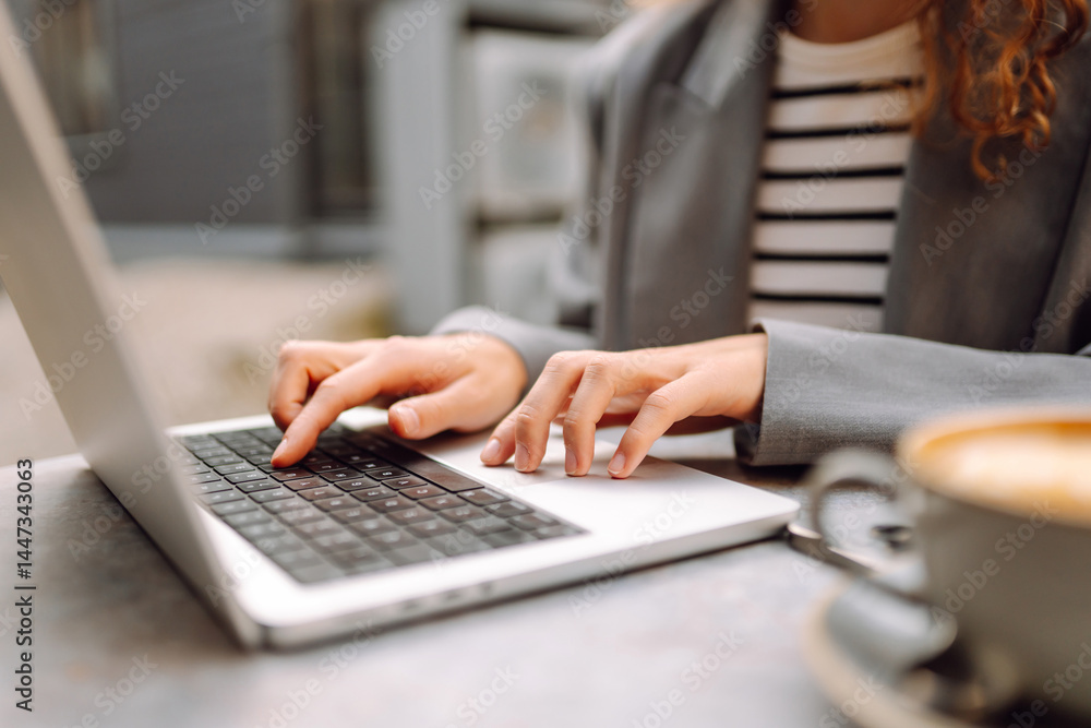 Beautiful woman in glasses with laptop working at table outdoors. Female freelancer with laptop in cafe enjoying weather. Technology concept, remote work. Beautiful woman in glasses with laptop working at table outdoors. Female freelancer with laptop in cafe enjoying weather. Technology concept, remote work.