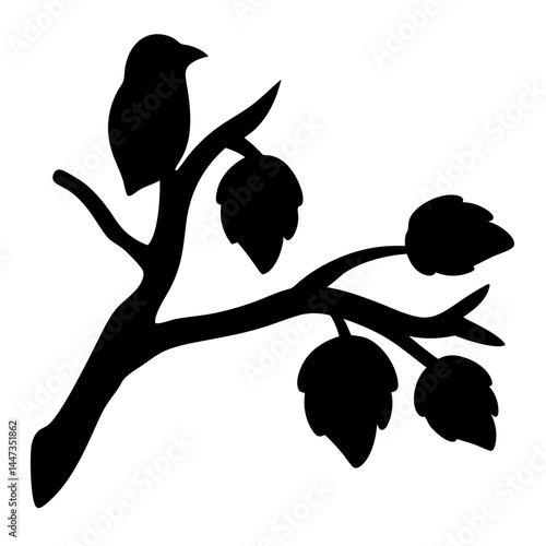 Silhouette of an owl perched on a bare tree branch at night