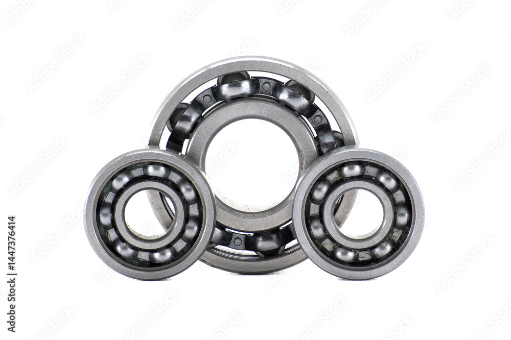 Three metallic ball bearings forming a triangular shape isolated on white background Three metallic ball bearings forming a triangular shape isolated on white background