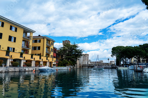 Sirmione view from Lake Garda of the entrance to Sirmione, a well-known Italian tourist destination also famous for the remains of the so-called Grotto of the Roman poet Catullus
