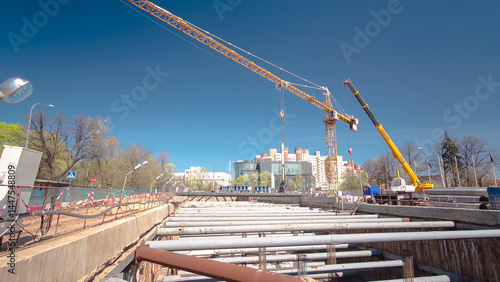 A large huge ditch pit tunnel timelapse hyperlapse at the construction site of the underground metro station line.