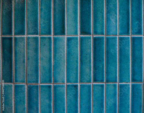 Tiles. A closed up texture of beautiful blue tiles for background pattern. Vintage film grained filter applied.