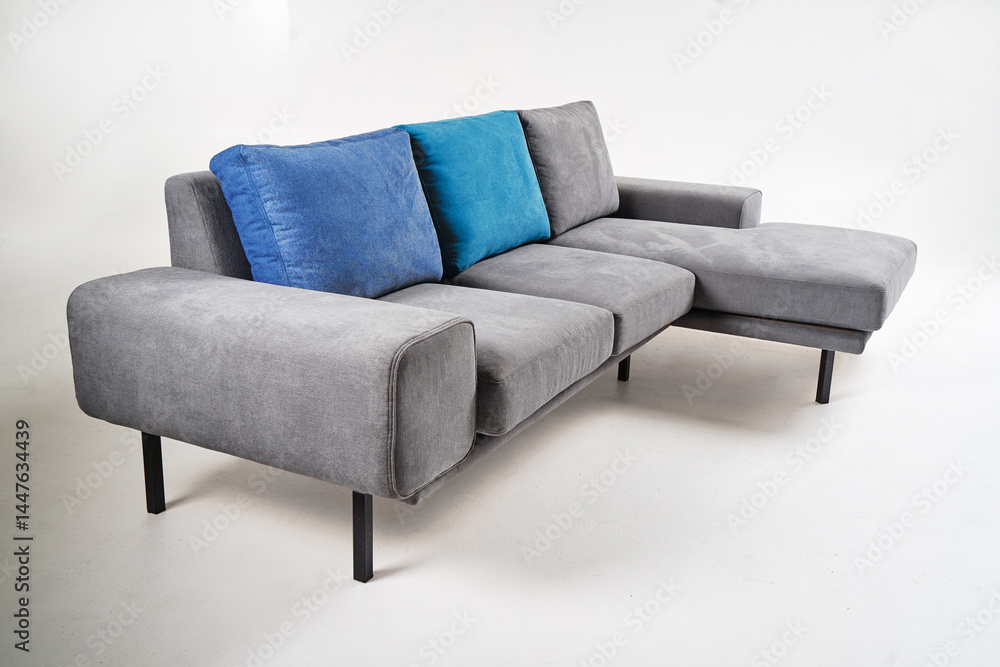 Modern Gray Sofa With Blue Cushions on White Background.. Modern Gray Sofa With Blue Cushions on White Background..
